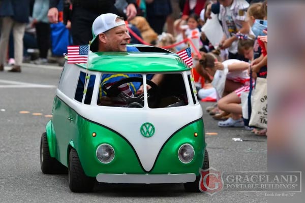 Miniature Volkswagen bus painted in Sheds Plus green and lime with the company logo at a Snohomish County car show
